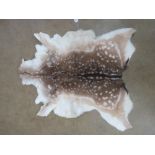 A deer skin throw / rug.