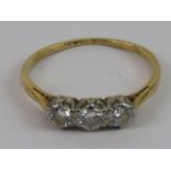 A vintage three stone diamond ring, set in white and yellow metal,