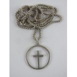 A silver crucifix pendant having cross within open hoop, stamped sil, on chain marked Sterling, 2.