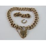A vintage 9ct gold charm bracelet with heart padlock clasp, stamped 9c throughout,