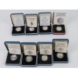 Silver proof one pound coins; 2000 (x2), 1987, 1983, 1986, 'Leek reverse', 1984, and 1988.