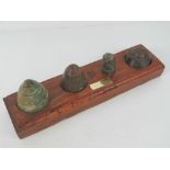 Four inert WWI shell fuse heads including; two British, one German and one French,