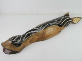 An African wall carving being the head of a Zebra and measuring 80cm in length.