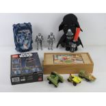 A boxed Bionicle Mahri Lego kit together with a Darth Vadar toy, two Cybermen figurines,