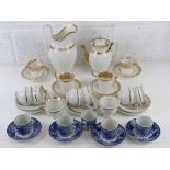 A set of four Noritake blue and white phoenix design coffee cans and saucers,