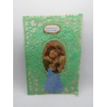 A decoupage Sweetheart or Valentines card, having green paperlace with central portrait,