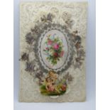 A decoupage Sweetheart or Valentines card having central floral motif and cherubs over paperlace,