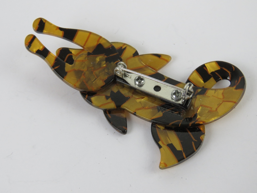 An overlaid plastic brooch in the style of Lea Stein, brown and black fox measuring 7.5cm in length. - Image 2 of 2