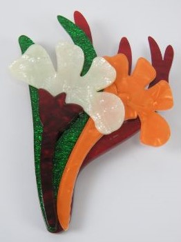 An overlaid plastic brooch in the style of Lea Stein in the form of a floral bouquet,