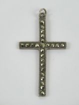A silver and marcasite cross or crucifix pendant, stamped Sterling to back, measuring 4.