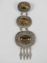 A large and impressive silver and tiger's eye pendant measuring 14.