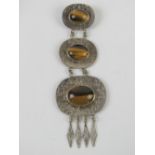 A large and impressive silver and tiger's eye pendant measuring 14.