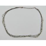 A silver and crystal Native American Navajo style necklace, stamped sterling with makers mark over,