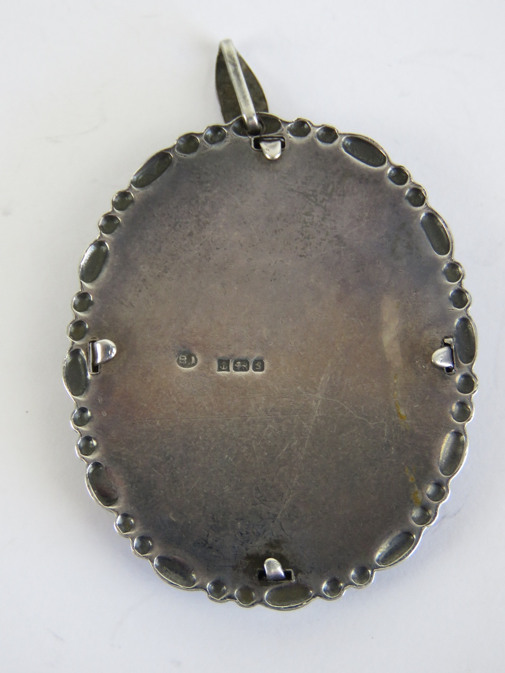 A HM silver pendant having lacework rose within, hallmarked for Birmingham 1981, 5.3cm in length. - Image 2 of 3