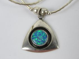 A 925 silver and opal pendant of geometric form on a Native American style beaded chain.