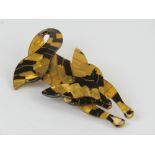 An overlaid plastic brooch in the style of Lea Stein, brown and black fox measuring 7.5cm in length.