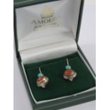 A pair of silver Native American style carnelian and turquoise earrings, stamped 925, 3cm drop.