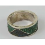 A silver Native American Navajo style crushed turquoise and onyx ring, stamped 925, size O-P.