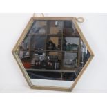 A contemporary Hexagonal wall mirror.