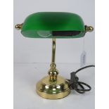 A 1/2 size brass 'bankers' lamp with green glass shade.