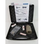 A Tactical torch and laser with pressure pad in box, with spare batteries, and accessories,