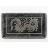 A black lacquered Chinese tray having silvered dragon design upon, 56.3cm wide.
