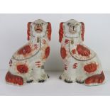 A pair of Staffordshire Spaniel figurines, a/f.