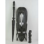 A contemporary ebonised wall mask from the Ubud region of Bali, approx 51cm in length,