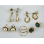 A quantity of yellow metal earrings, all pairs, two set with pearls.