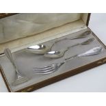 A German silver Christening set in original fitted box comprising fork, spoon, teaspoon and pusher,