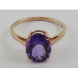 An amethyst cocktail ring, stamped 10k with 9ct gold hallmark, oval cut stone approx 2.87ct (11 x 8.