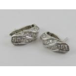 A pair of 14ct white gold earring set with white stones, stamped 585, 3.89g.