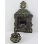 Two carved wooden decorative shrine ornaments decorated with pressed metal 'leaves' and panels.