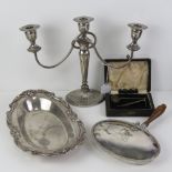 A quantity of silver plated items including three arm candelabra.