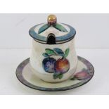 A Carlton Ware lustre preserve or jam pot with lid and drip tray, Rd No 725809.