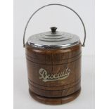 A vintage oak biscuit barrel.