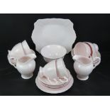 A blush pink tea set by Tuscan comprising jugs, milk, sandwich plate and trios.