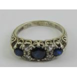 An Asprey & Co vintage 9ct gold sapphire ring, the central round cut royal blue sapphire approx 0.