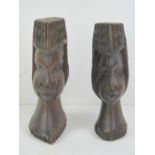 A pair of wooden carvings being male and female bust, each approx 17cm high.