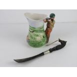 A hunting themed ceramic jug together with a horse head shoe horn.