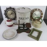 An enamelled bread bin, balance scales, enamelled dish, clocks, etc.