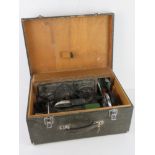 A Singer sewing machine in original case with Singer rubberised mat and cardboard box of