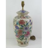 A ceramic table lamp in the style of a Chinese ginger jar having Iris and other floral design upon,