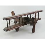 A vintage wooden model of an aeroplane, 50cm wide.