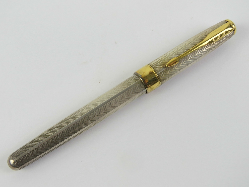 A Parker Sonnet hallmarked silver fountain pen with 18ct gold nib.