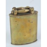 An early 20th century French table lighter in brass, cotton wick exposed by lifting up a lever,