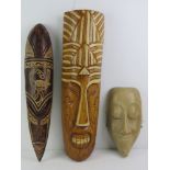 A Tiki hand carved and stained wall mask bearing label verso 'Tikeh' and measuring 51cm in length,