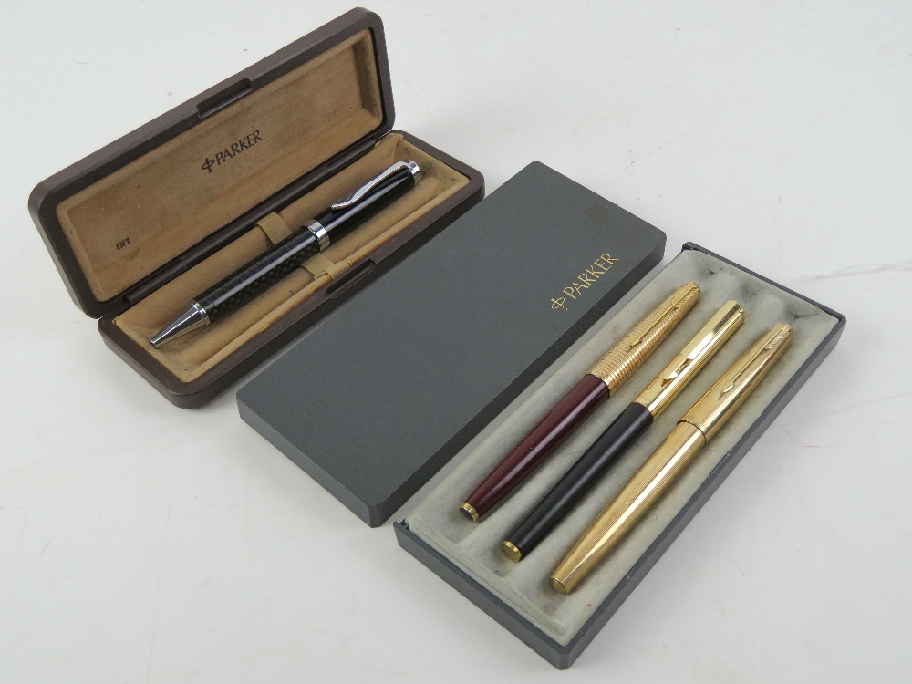 Two Parker fountain pens, together with a Mercedes pen and another Parker, within two Parker boxes.