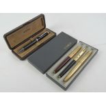 Two Parker fountain pens, together with a Mercedes pen and another Parker, within two Parker boxes.