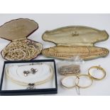 A quantity of costume jewellery including rolled gold bangles.